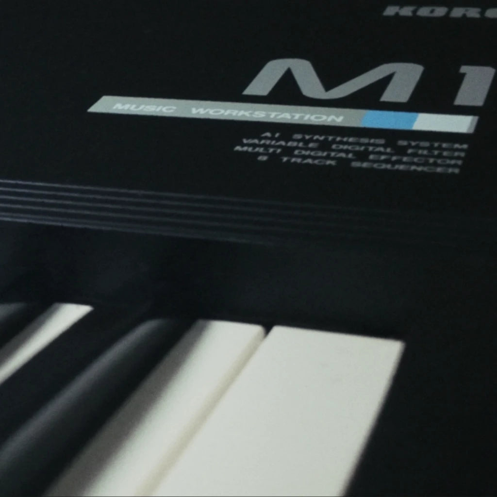 Close-up of a Korg M1 music workstation with keyboard keys.
